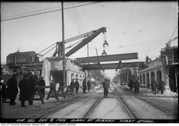 old black and white photo from 1915, City of Toronto Archives, of building of the railway bridge over Queen East at Riverdale station 