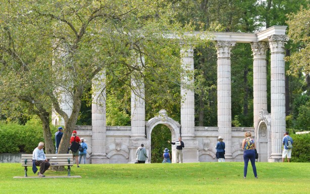 large stone columns in a park, old architectural details from a building that was demolished, columns saved and moved here to Guild Inn 