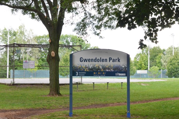 Gwendolen Park sign with tennis courts in the background