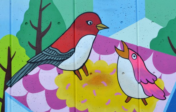 two birds in a mural by K J Bit Collective 