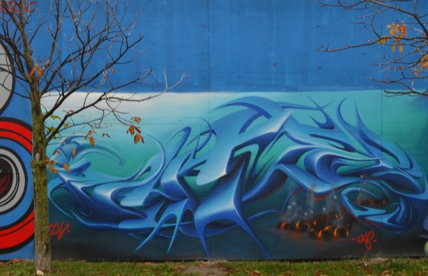 mural, in blues, stylized waves, or text, could be either