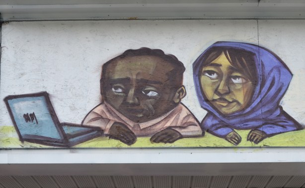from a mural by elicser on an old 7-Eleven building on the Danforth, a couple is looking at an open laptop together, brown skin, woman in blue head scarf
