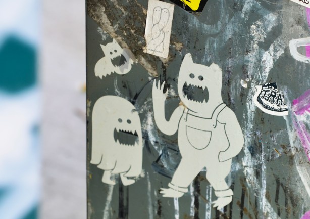 ghostly white paper slaps on a met box, ghost faced bat, also bear in overalls, 