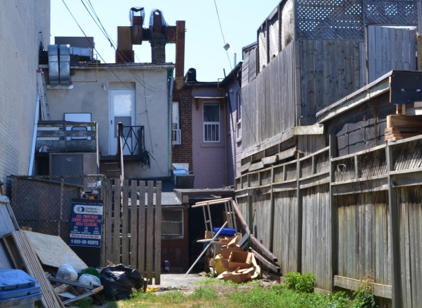 back of a store on Danforth with apartments above