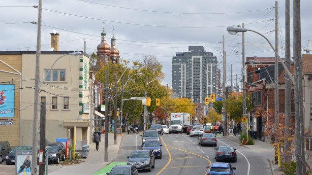 looking east on Dupont, traffic on the street, stores lines streets
