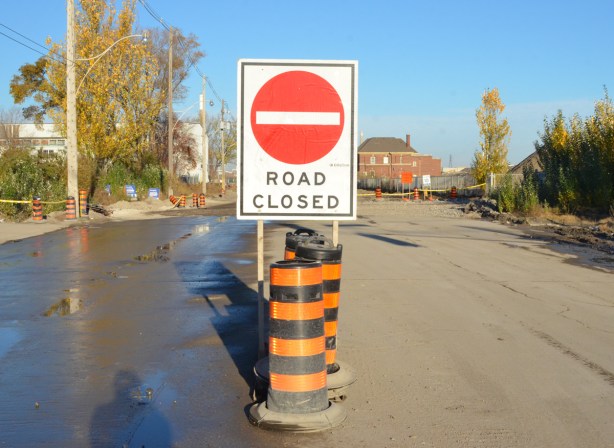 road closed sign in the middle of the street, commissioners street in the port lands 