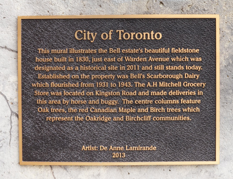 bronze city of toronto plaque describing the mural on Warden ave 