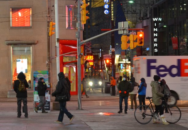 people at Yonge Dundas Square after dark 