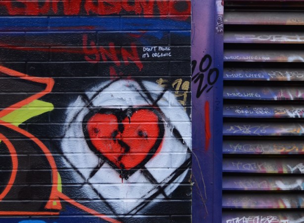 graffiti, red broken heart on white circle