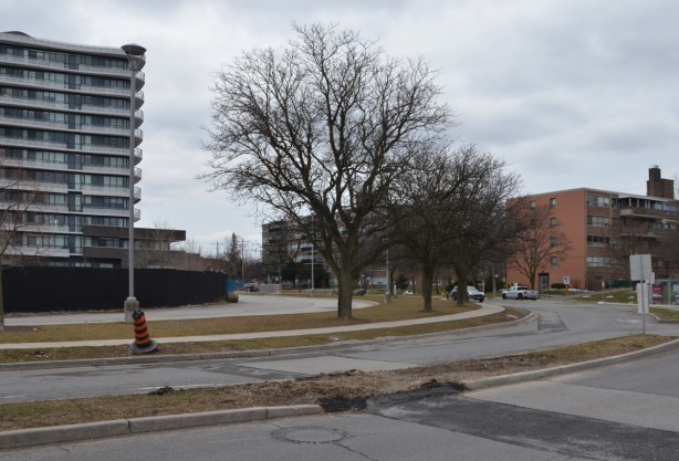 Donway West, older low rise apartments on the right, taller and newer condos on the left 