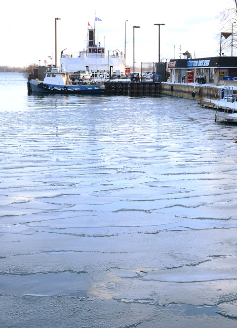 ice starting to form in harbour where the Toronto island ferry is docked 
