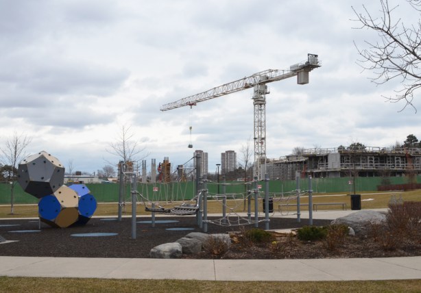 playground in the front, construction behind that, and Scarborough skyline in the distance 