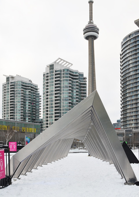metal sculpture called Iceberg in Canada Square with the CN Tower in the background