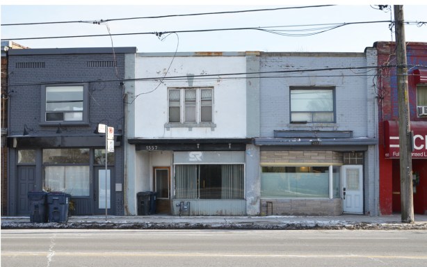 three empty storefronts at 1557, 1559 Kingston Road, two storey buildings in shades of grey 