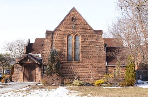 St Nicholas church, red brick, no steeple, but a pointed roof