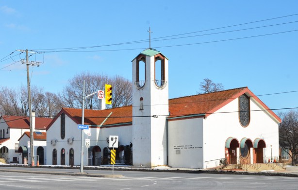white church at Midland and Kingston Road, Saint Theresa Parish, Shrine of the Little flowers, red cermaic tile roof, arched doorways and windows