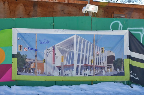 picture on green hoardings, an image of what Avenue Road subway station is going to look like when its finished