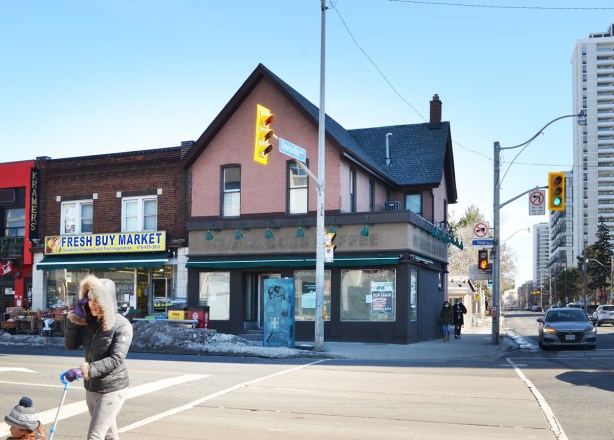 Starbucks, now closed, in an older building at Yonge and Davisville, for lease sign iin the window 