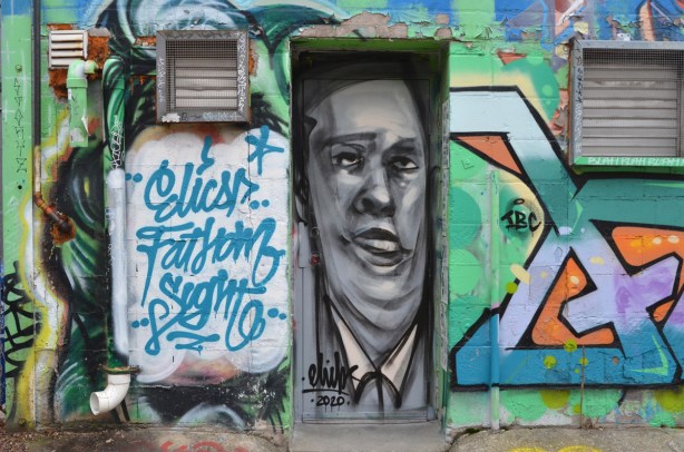 mans face painted by elicser in a doorway