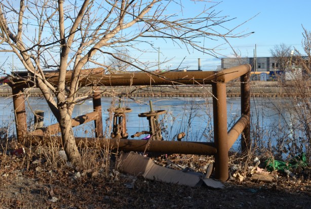 old metal pieces of hardware, pipes and valves?, rusty, beside the Keating channel