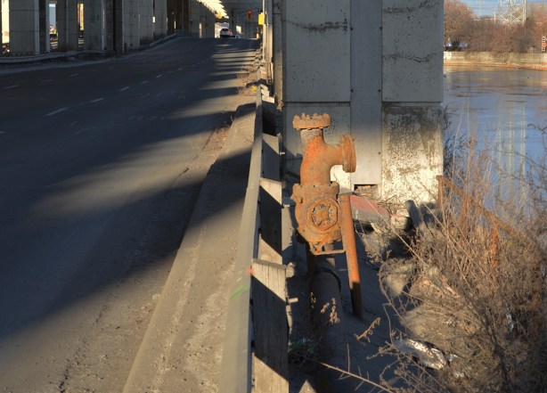 old rusty large valve for a pipeline, beside Lakeshore Blvd, 