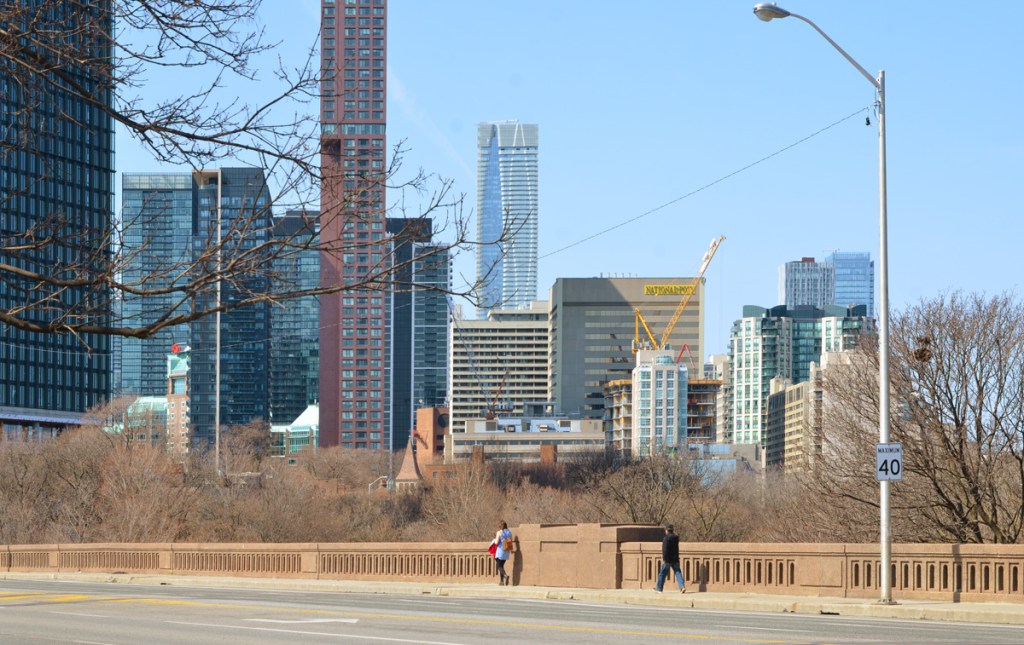 view from Bloor street east bridge over rosedale valley road, looking towards downtown and the skyscrapers of the city near Yonge and Bloor.  looking mostly west