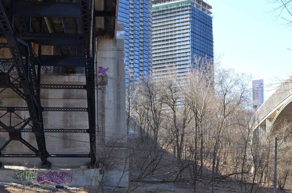 two bridges, Bloor street east on the left and covered subway bridge on the right, in the distance, condos and tall buildings on Bloor Street