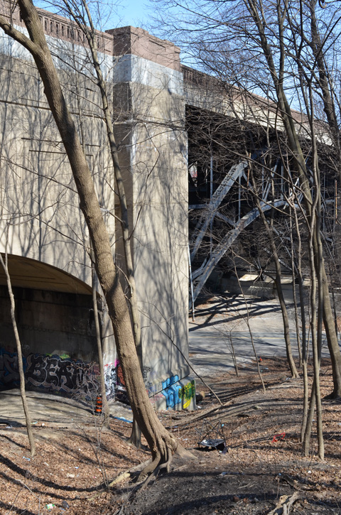 bridge, all concrete on left side but with metal girders across the larger middle span