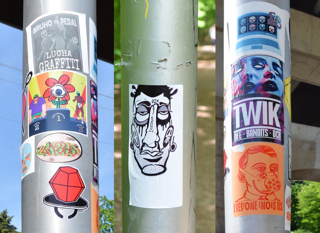 3 poles with stickers on them