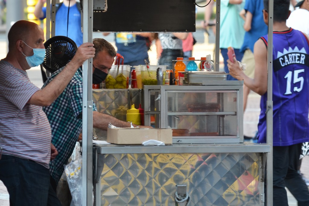 hot dog and sausage street vendors at work