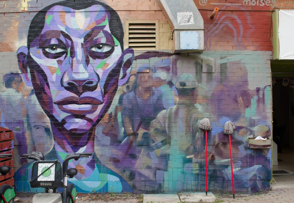 large mural of a mans face in Kensington