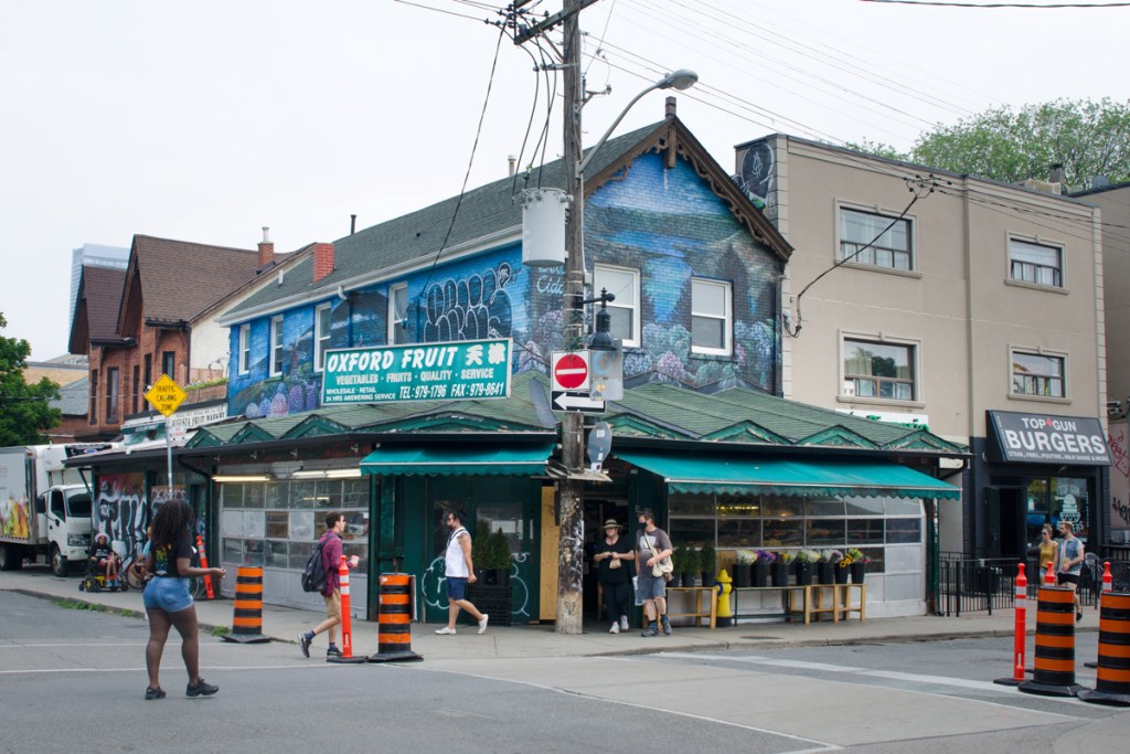 the Oxford Fruit Market, painted blue, on the corner of Augusta
