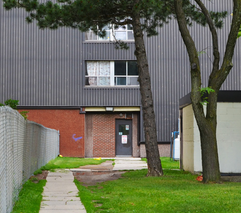 path across lawn, entrance to apartment building