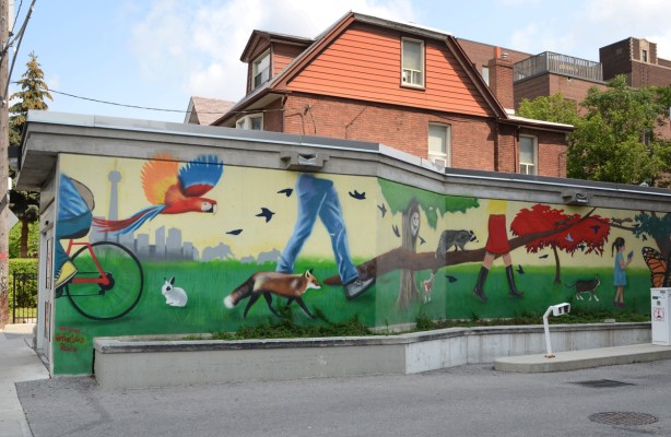 mural on the exterior of west exit from Dufferin station by Ted Hamer, of a country scene, a fox, and some people walking