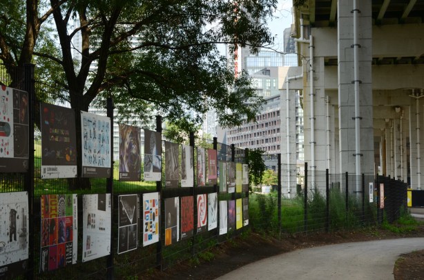OCADU art display on fence between Fort York and the Bentway