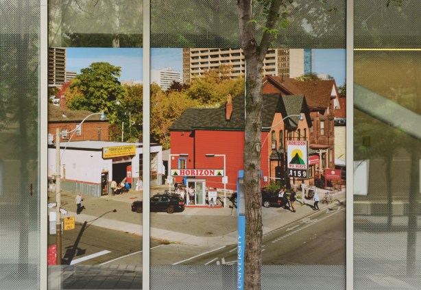 a coloured photo of a corner of an intersection with a gas station on it, Horizons, houses, apartment building in background 