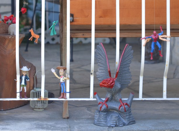 toy characters decorating a porch, woody from toy story,