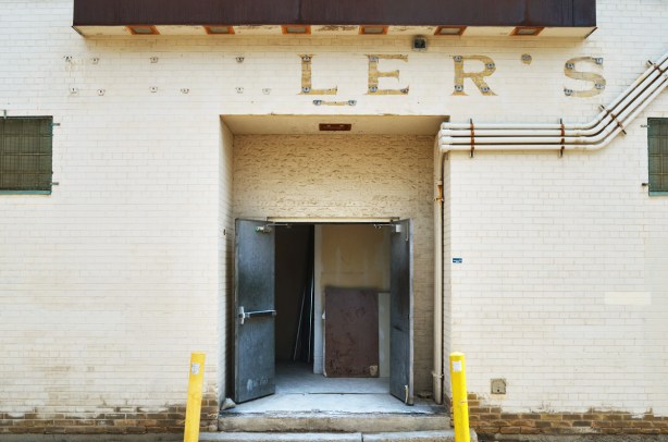 back entrance, open doors, of what used to be Zellers. Some of the letters of the name are still there, l e r s 