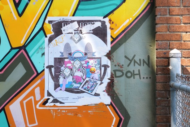 paste ups and paint on a wall, skulls, zonr, 