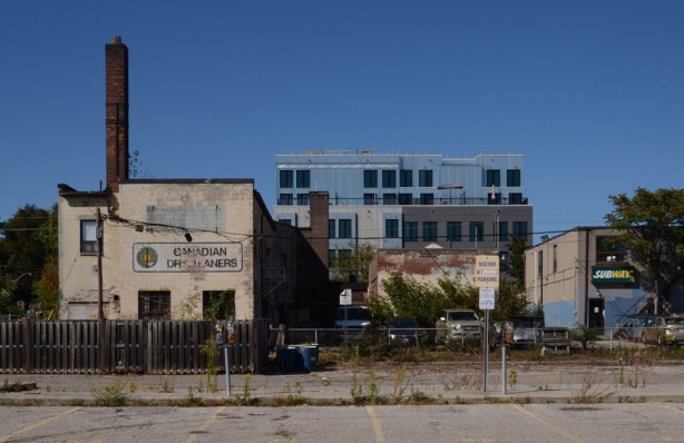 beind the buildings on the south side of Queen East, near Coxwell, Subway, Canadian Dry Cleaners, 