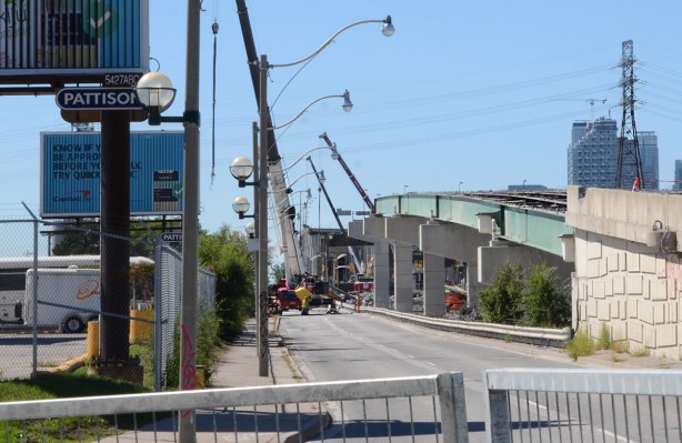 side view, Lakeshore looking west from Bouchette, middle of Gardiner demolition, road surface is missing but steel structure is still there