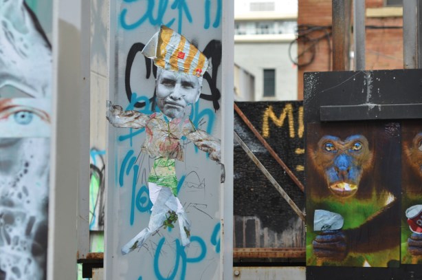 paste platz, wheatpaste papers on a wall, monkeys with cans