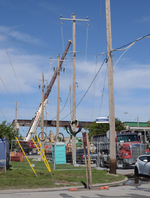 new utility poles at a construction site, hydro poles