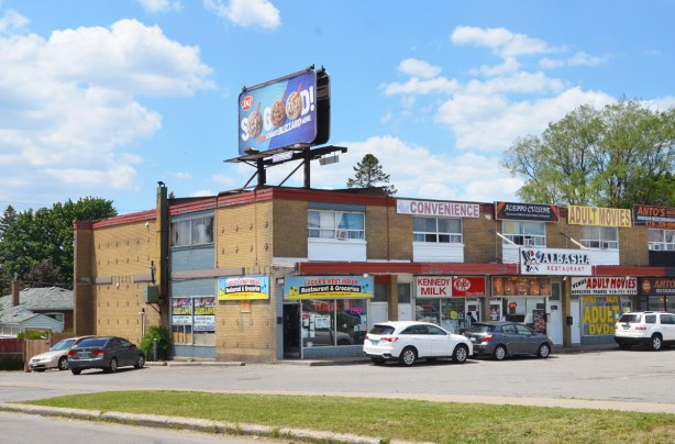 two storey brick plaza with many stores