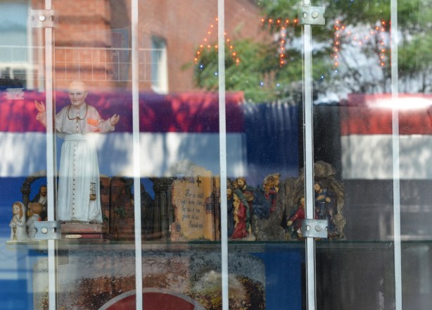 reflections of a TTC streetcar in a store window