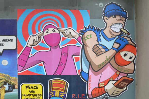 visual noise and urban ninja squadron, paste platz, wheatpaste papers on a wall