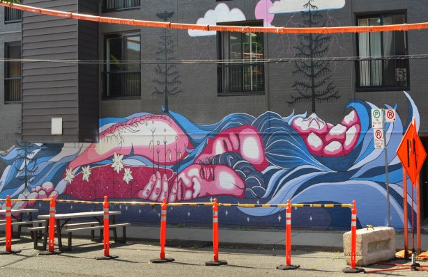 the word life painted on a fence white letters on blue background