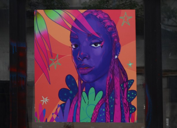 image by Curtia Wright, woman with purple skin and pink hair, head and shoulders portrait