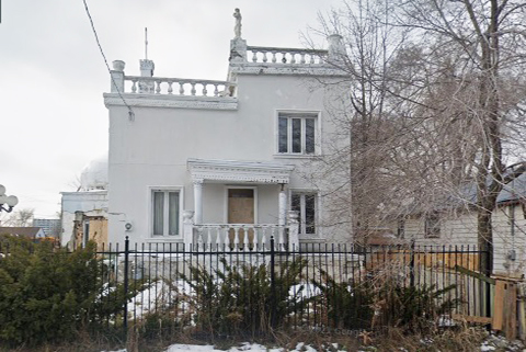 screenshot from google maps street view of an old white house