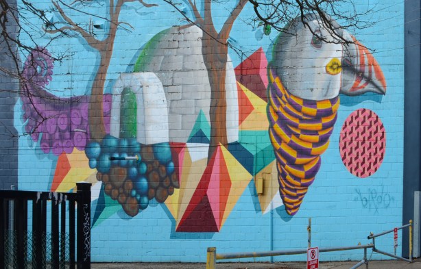 large birdo mural on the side of a building, street art